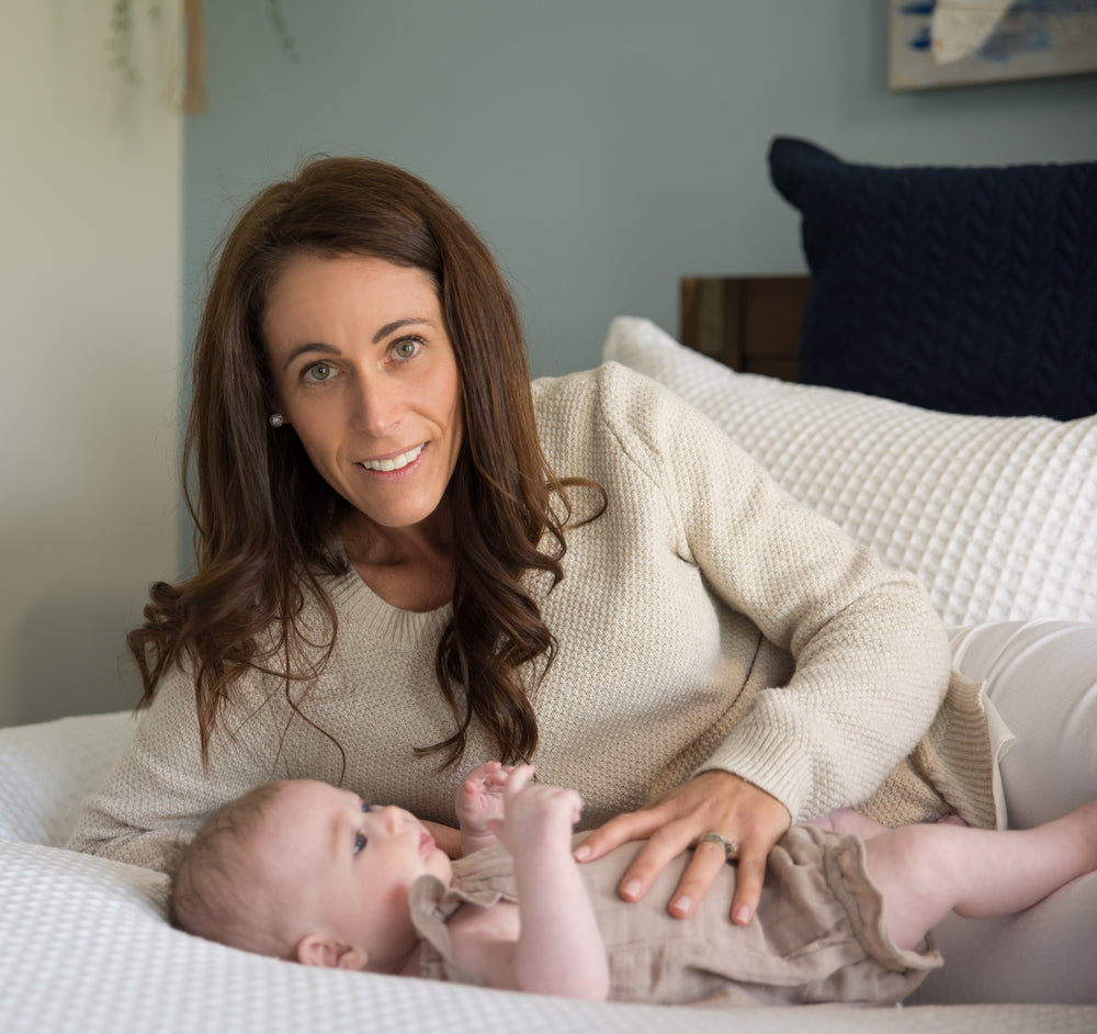 Happy parents with sleeping baby